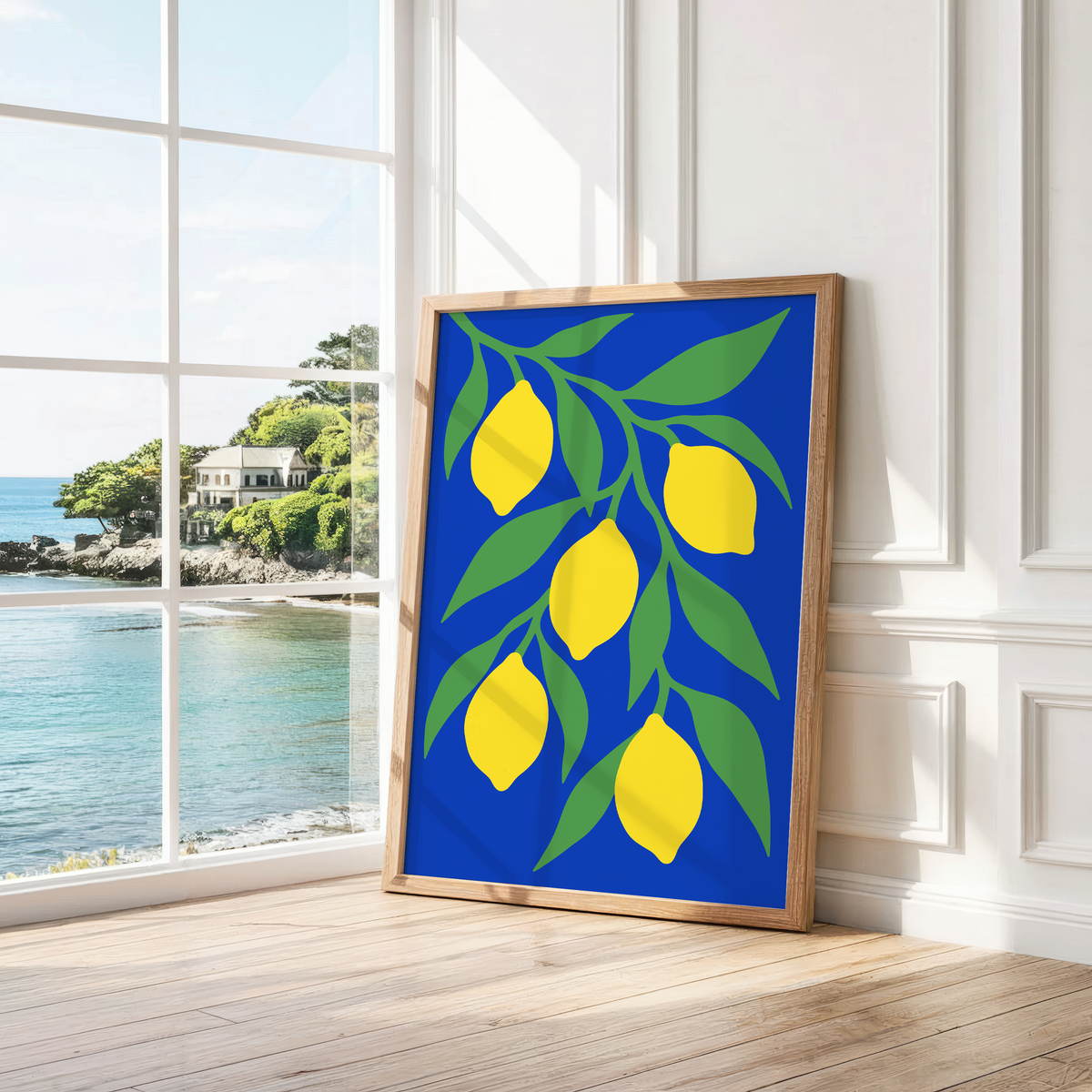 Five yellow lemons on a leafy branch leaning by a bright window with a sea view
