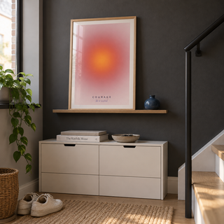 Warm coral halo gradient print in a stair landing against a charcoal wall