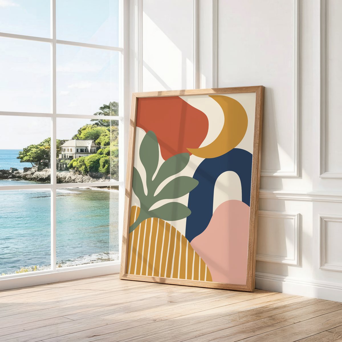 Cut paper print with a navy arch leaning by a bright window with a sea view
