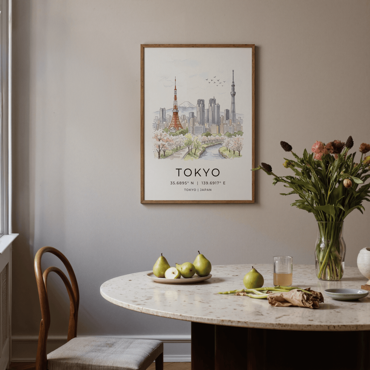 Tokyo Skyline Art Print framed above a dining table with green pears and flowers in soft watercolour
