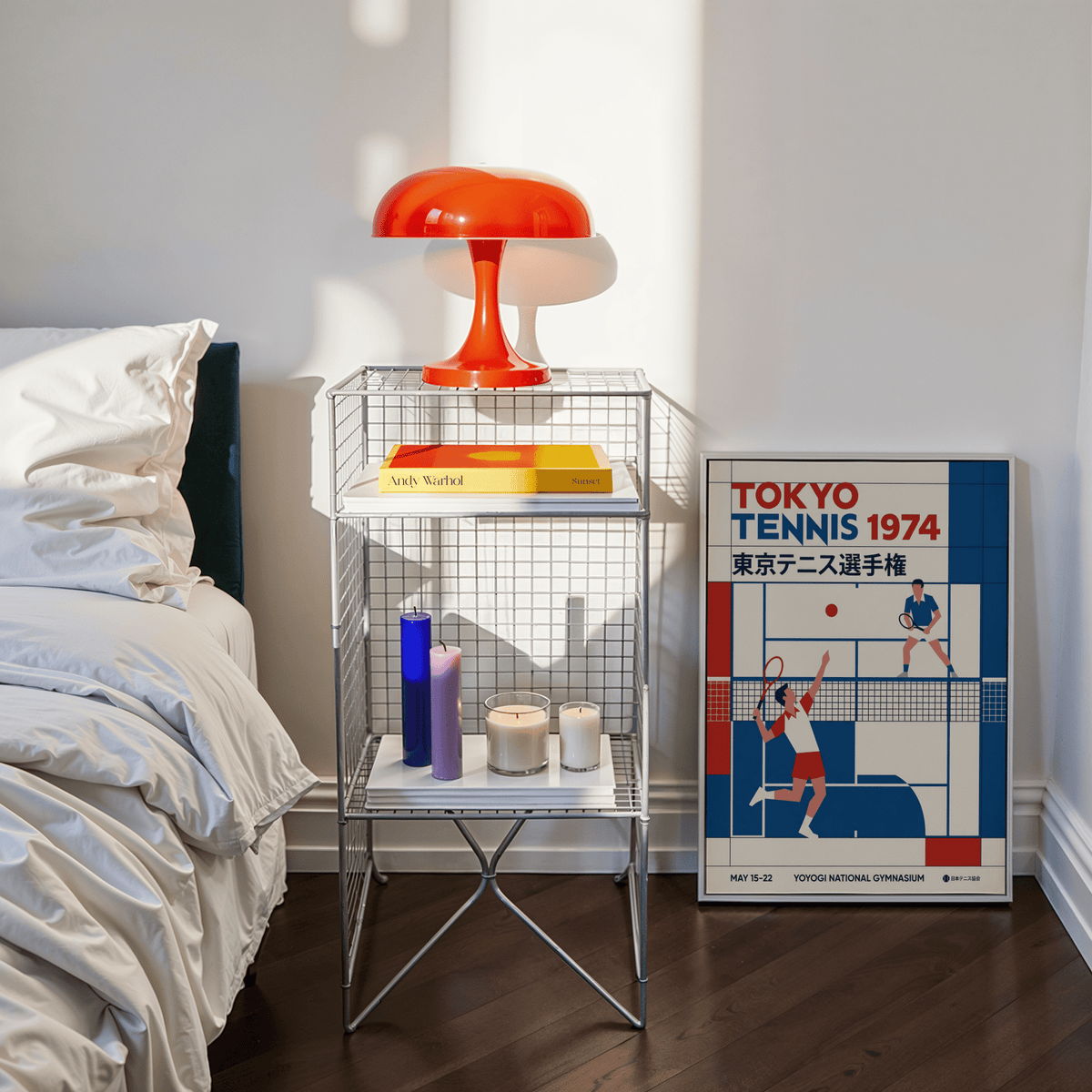 Print leaning on a floor by a bedside table with red lamp Tokyo Tennis Poster in retro blue and red tones