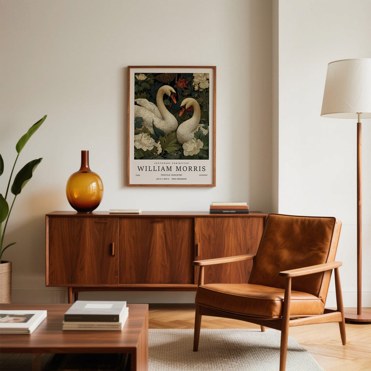 Swan wall art in a living room with a leather armchair and a wooden sideboard