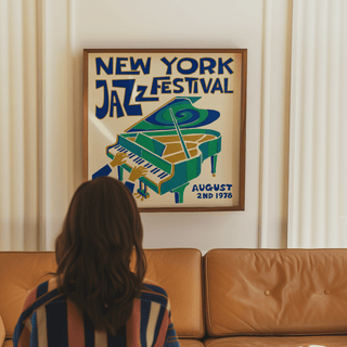 New York Jazz Festival print on a wall with jazz piano illustration above a tan leather sofa