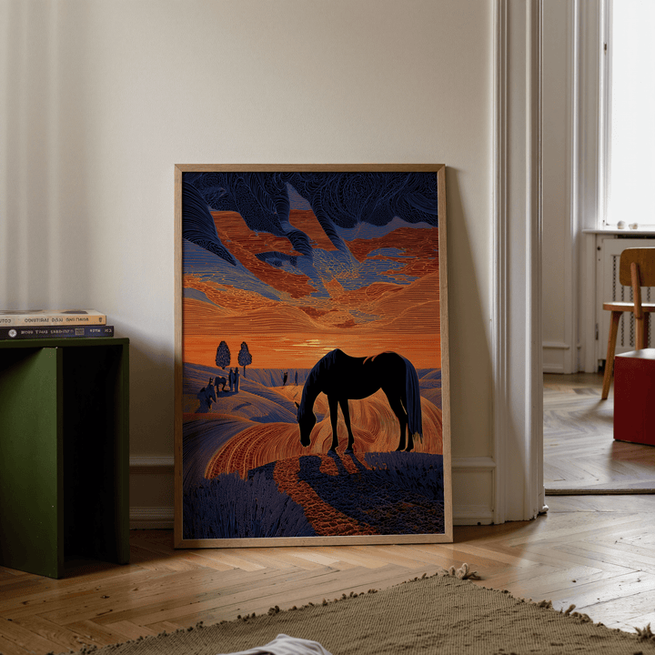 Print leaning on floor of horse silhouette with orange and blue sunset in a modern room
