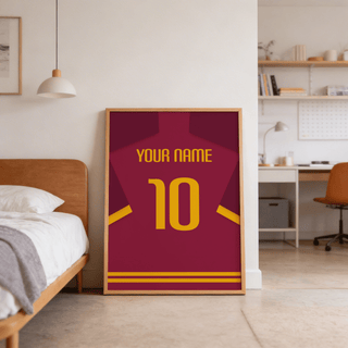 Print leaning on floor of minimalist football shirt poster in maroon with yellow number near bed in bedroom