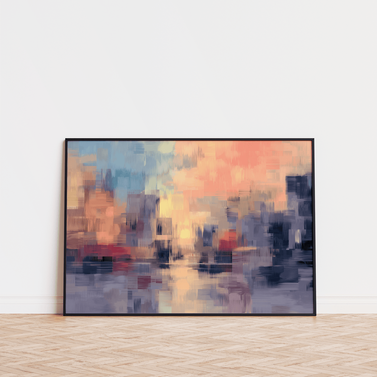 Abstract sunset art print leaning against a white wall on a herringbone wood floor