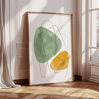 Abstract Watercolor Art leaning on a floor with green and yellow shapes and abstract lines in natural light