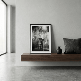 Nature Photography wall art of an elephant in forest light leaning on a floating wooden shelf with a black vase