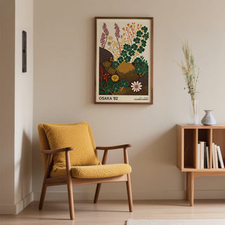 Wildflower art prints in a minimalist botanical-illustration style with green clover and flowers on a living room wall above a mustard