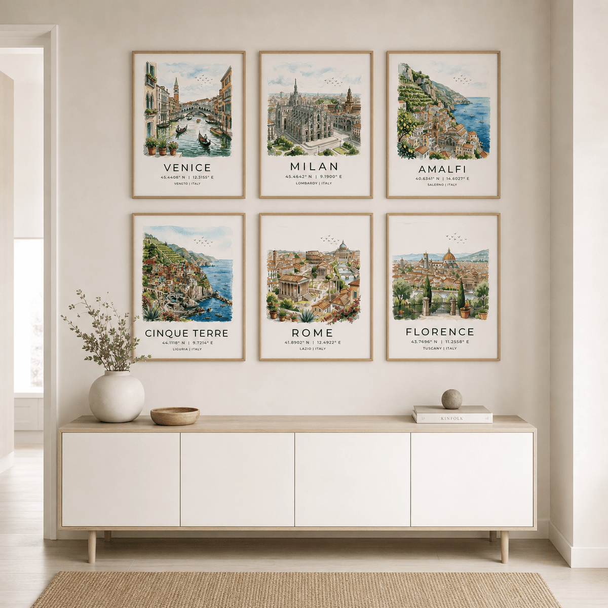 Italy Travel Wall Art set of six travel illustrations in soft watercolour hanging above minimalist white sideboard with vase