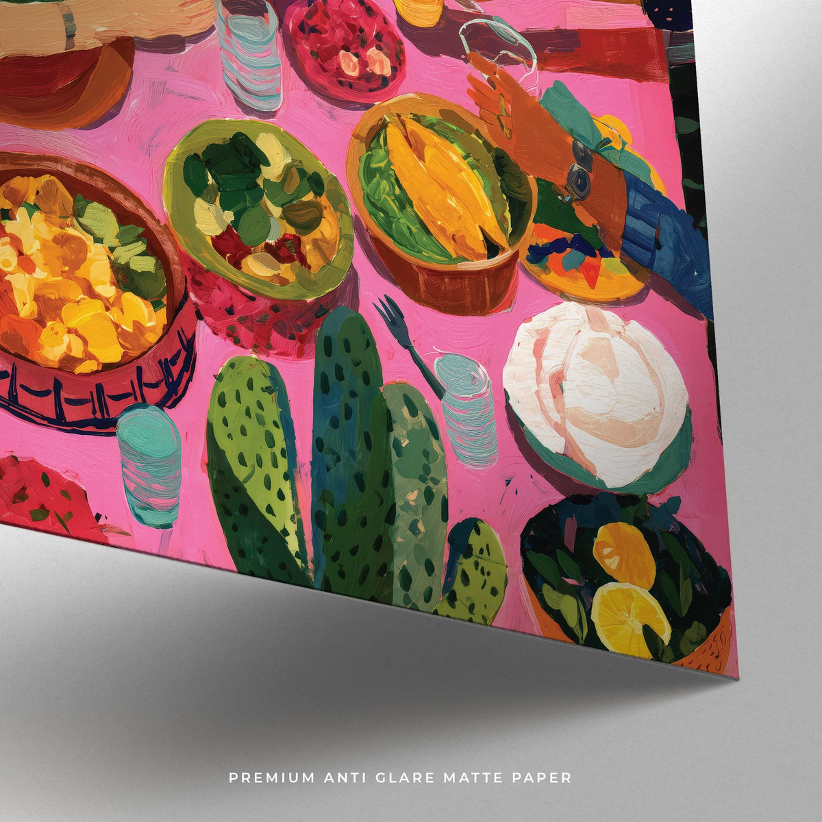 Close-up of Mexican Decor showing colourful plates and food on a pink tablecloth with cactus illustration