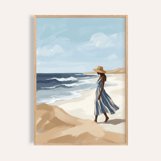 Coastal wall art set print of a woman on the beach in a blue and white striped dress with a straw hat