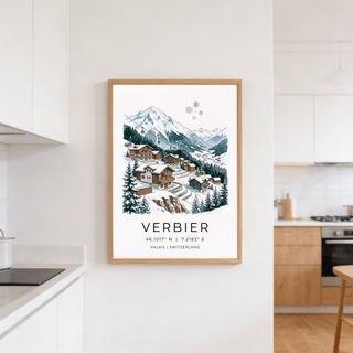 Framed Verbier Mountain wall art of an alpine village and snow-covered mountains in a white kitchen