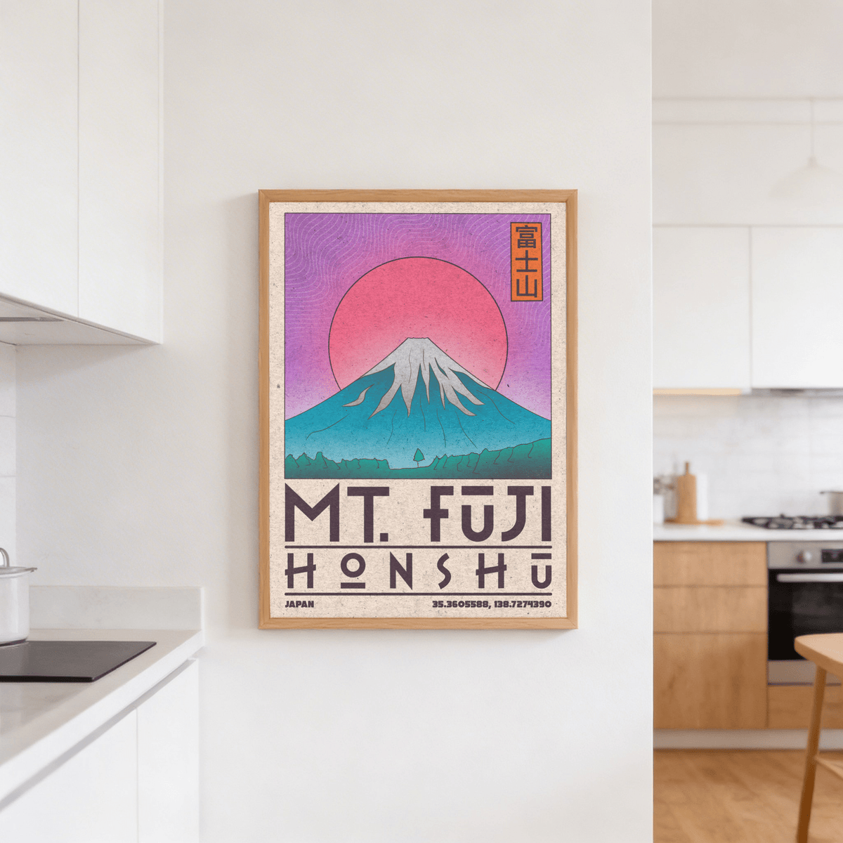 Mt Fuji art print with pink sun and blue mountain in a kitchen above a cooker