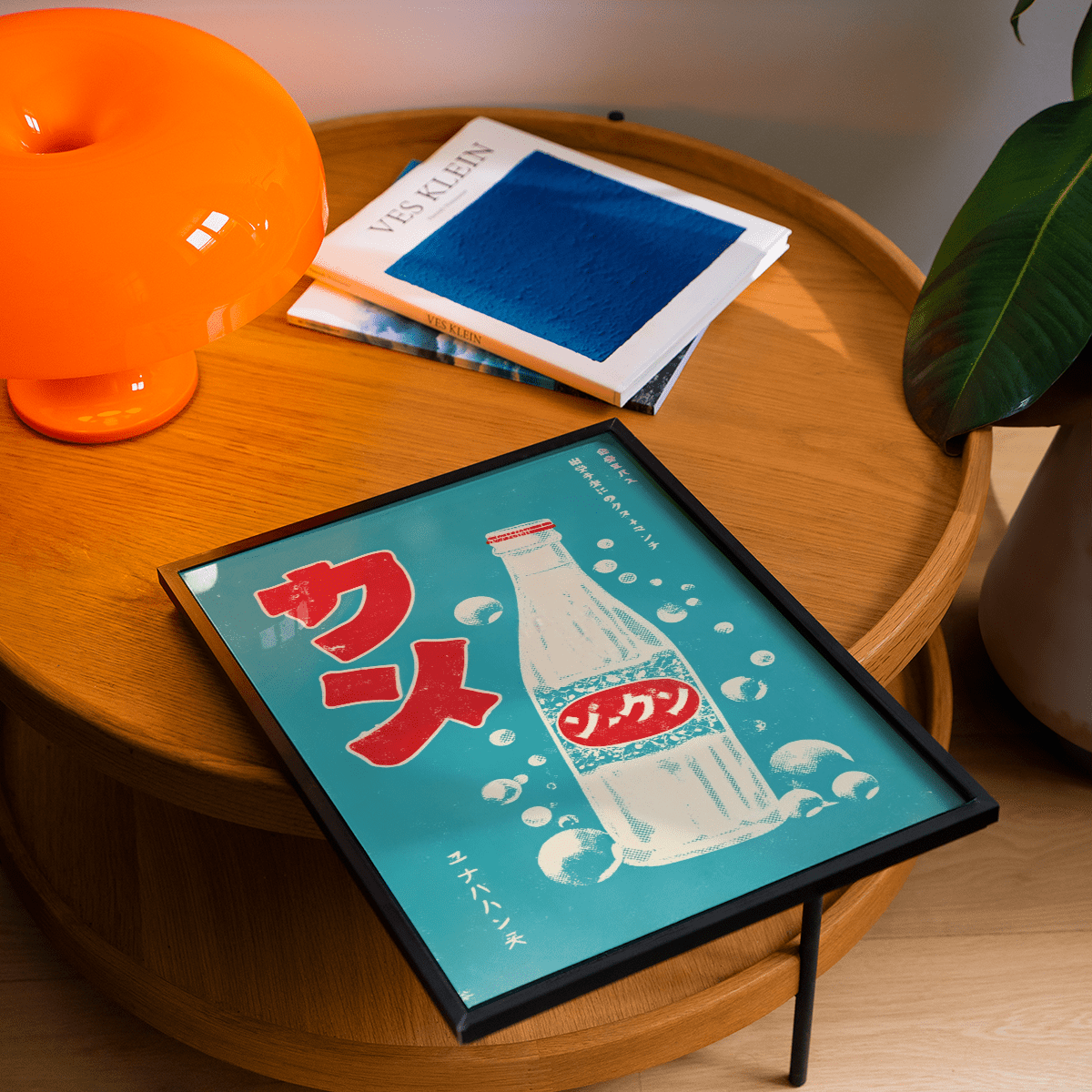 Framed Japanese Drink Art print with retro soda bottle in red and teal on a wooden table near an orange lamp