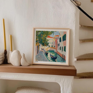 Print of Venice wall art of watercolour gondolas leaning on a wooden shelf with candle holders