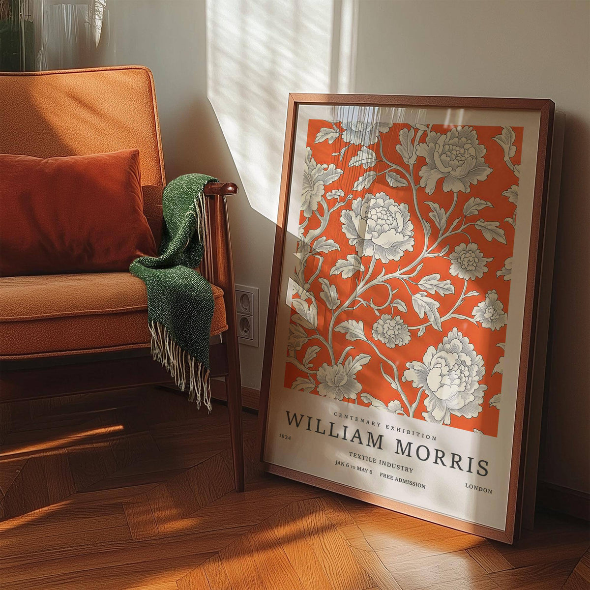 Print leaning on floor Vintage Flower Art showing white peony flowers on orange near an orange chair with green throw