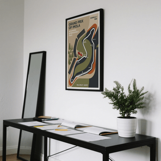 Imola Circuit Map Poster print on a wall in a room with a black table and a green plant
