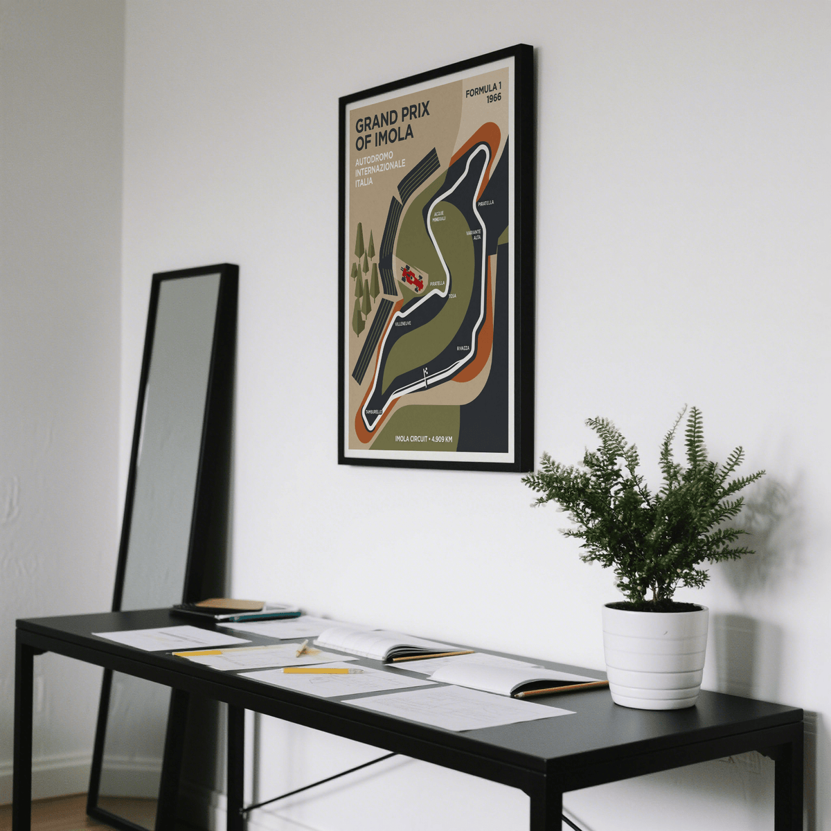 Imola Circuit Map Poster print on a wall in a room with a black table and a green plant