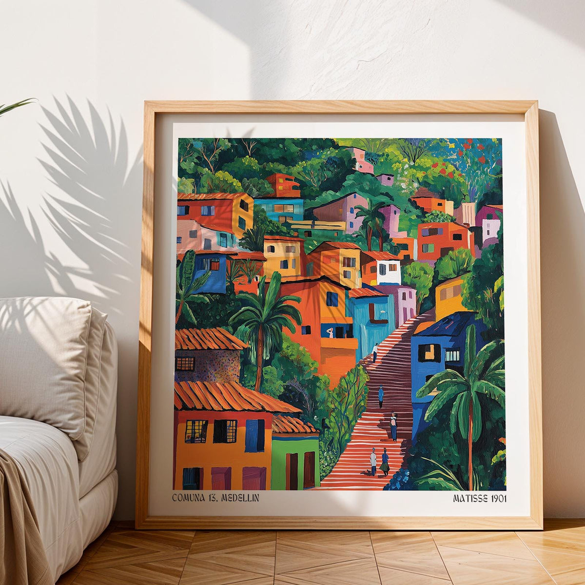 Framed Comuna 13 Art of colourful hillside houses with green trees near a beige sofa