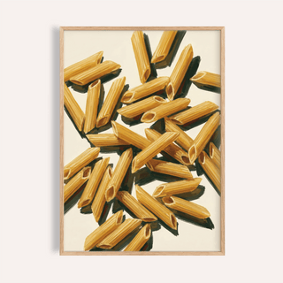 Framed Penne Art print close-up showing golden yellow pasta shapes on a cream background
