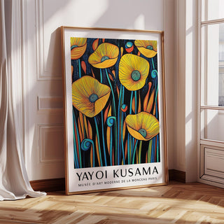 Poppies wall art leaning on the floor with yellow flowers and blue stems by a window in a bright room
