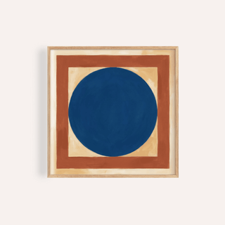 Framed print close-up of abstract artwork with a large blue circle and rust coloured border