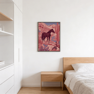 Western Horse wall art of a black horse in a red desert above a wooden bedside cabinet