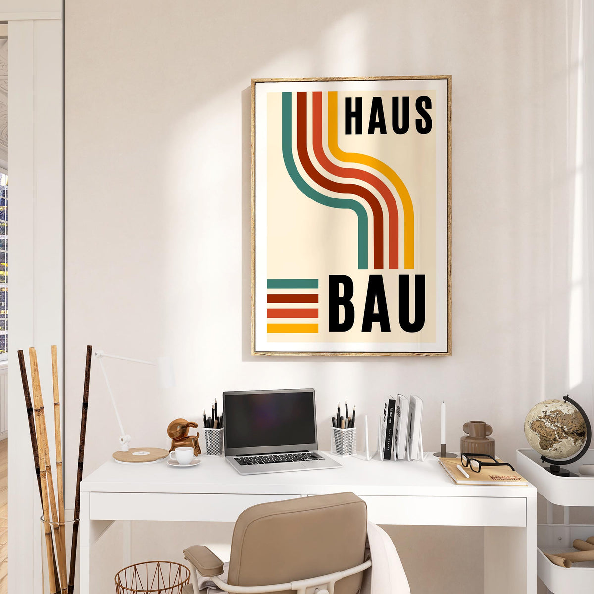 Artwork for the Office of retro curved lines in green brown red and yellow above a white desk in a bright office
