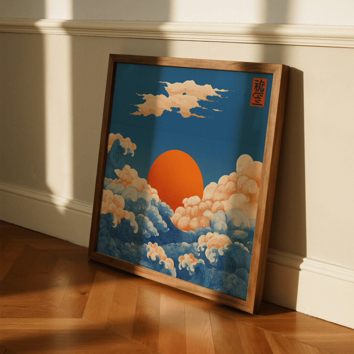 Square Prints for Wall leaning close-up of ocean sun print with orange sun and blue waves on a wood floor