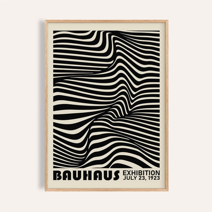 Framed black minimalist wall art with a black and white optical illusion and bauhaus text