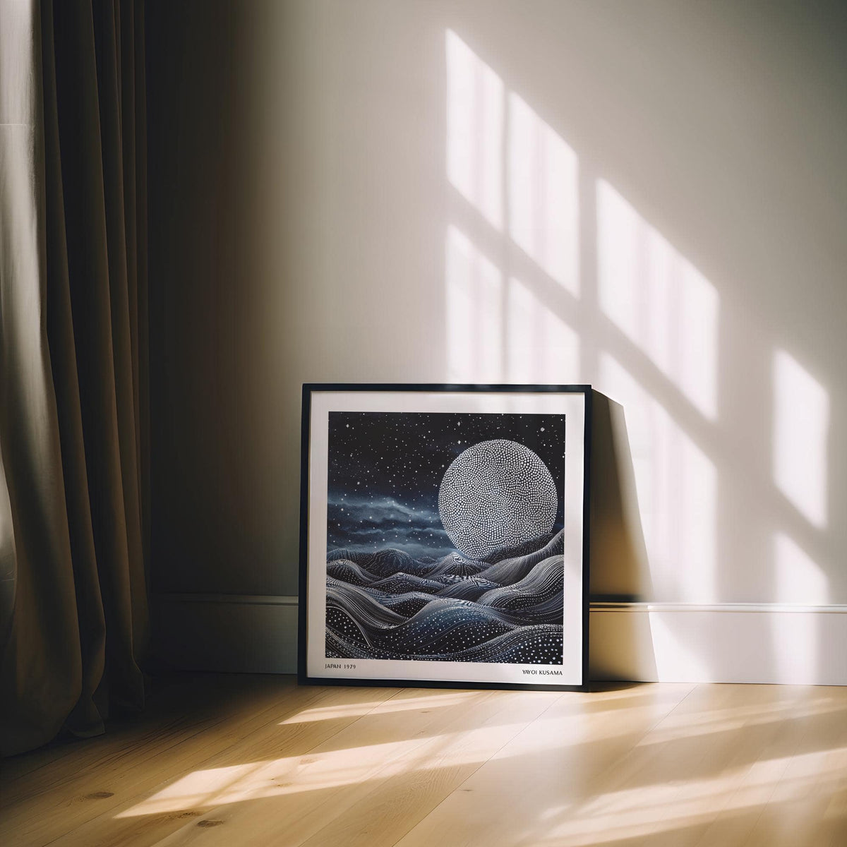 Print leaning on floor of surreal moonlit scene with dotted moon and flowing hills in dark tones