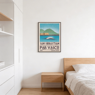 Pais Vasco print of a breaking wave and green hills above a wooden bedside table in a bedroom