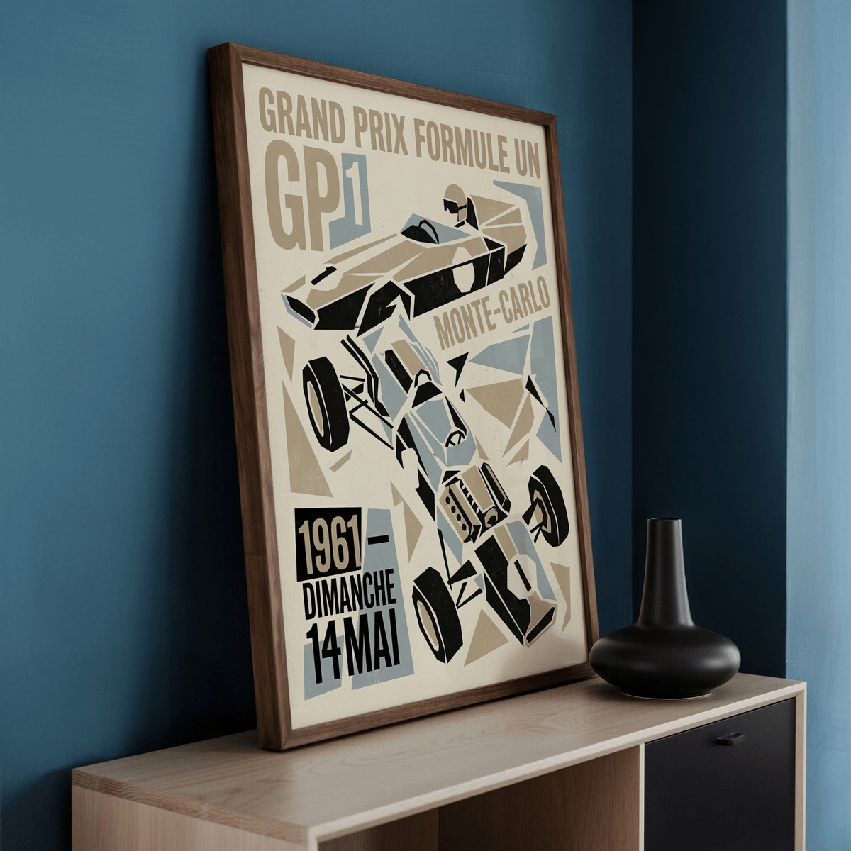 Grand Prix Typography Art Print framed close-up with brown and blue abstract race car leaning on a wooden surface and black vase nearby