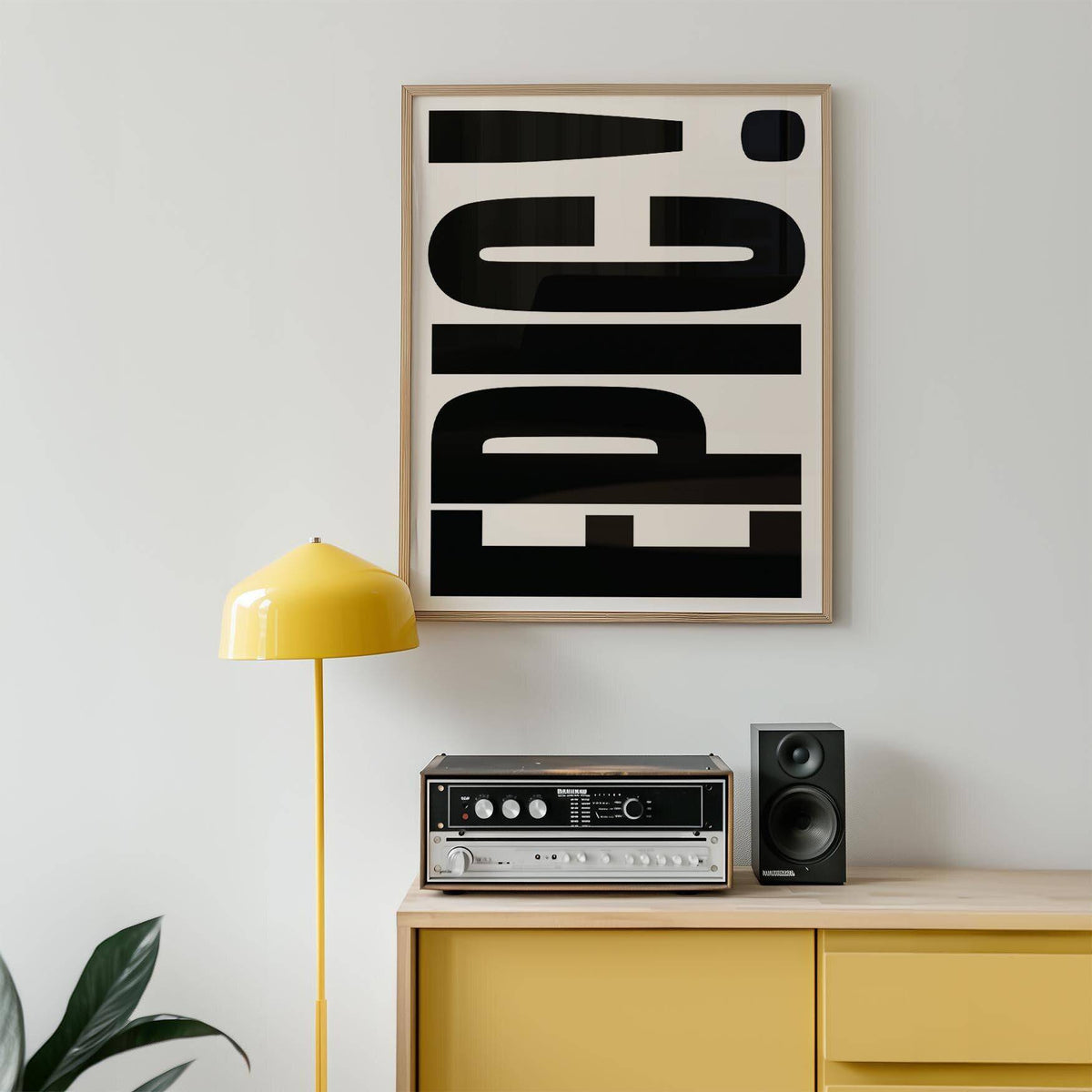 Big Text Sign wall art with bold black EPIC typography above a yellow lamp and retro music system