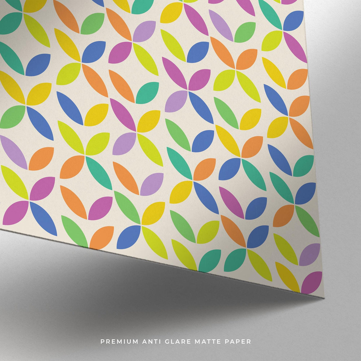 Close-up of colorful Bauhaus poster showing abstract colorful petal shapes on matte paper