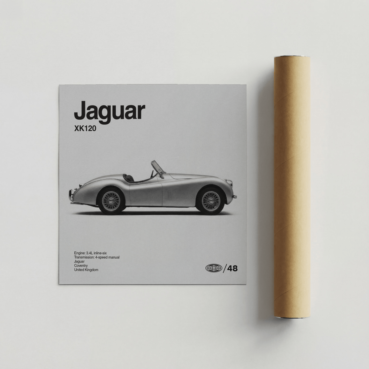 Vintage 1950s Roadster Poster beside a rolled brown packaging tube on a pale background