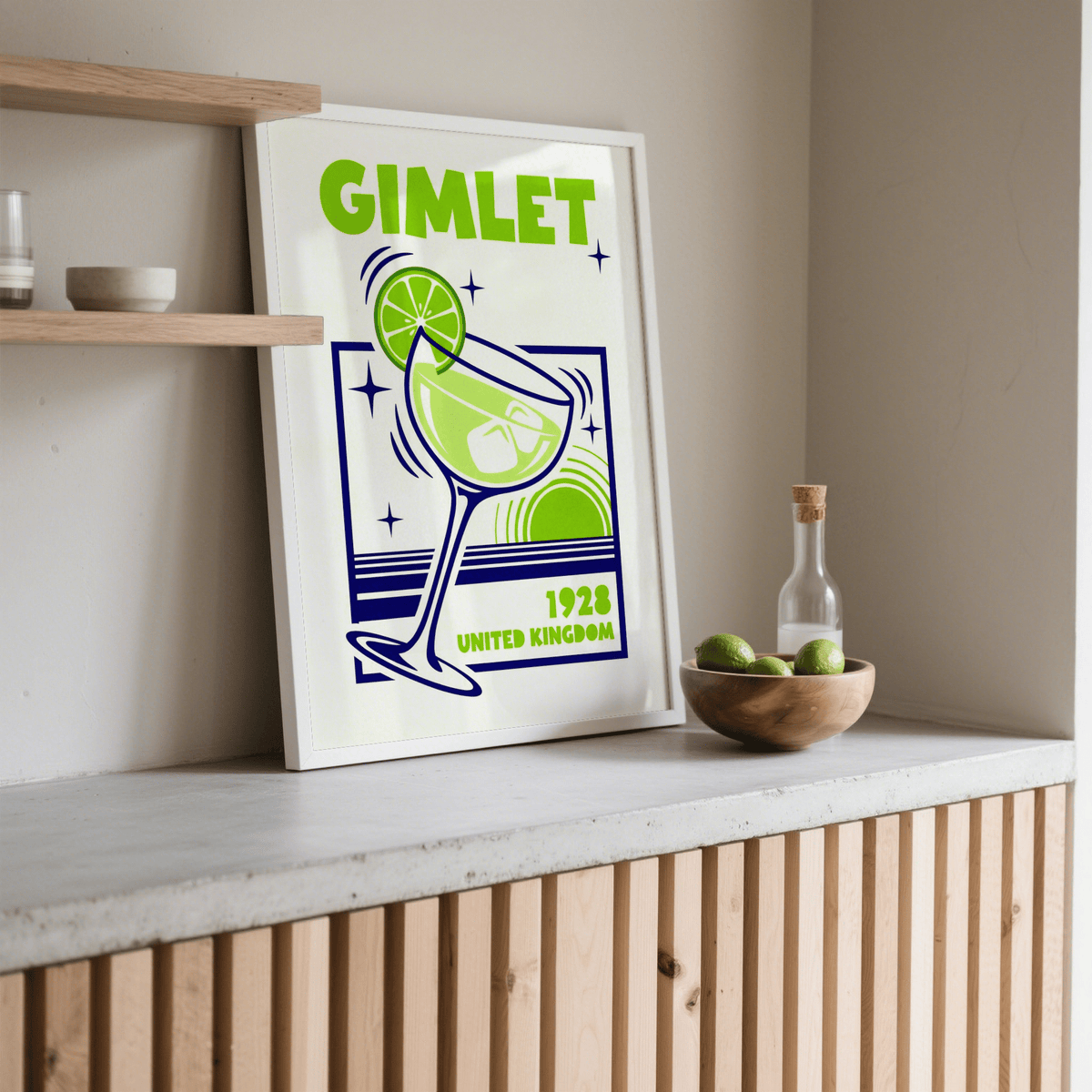 Gimlet Cocktail Poster leaning on a shelf with a minimalist retro design in green and navy alongside a bottle and bowl of limes