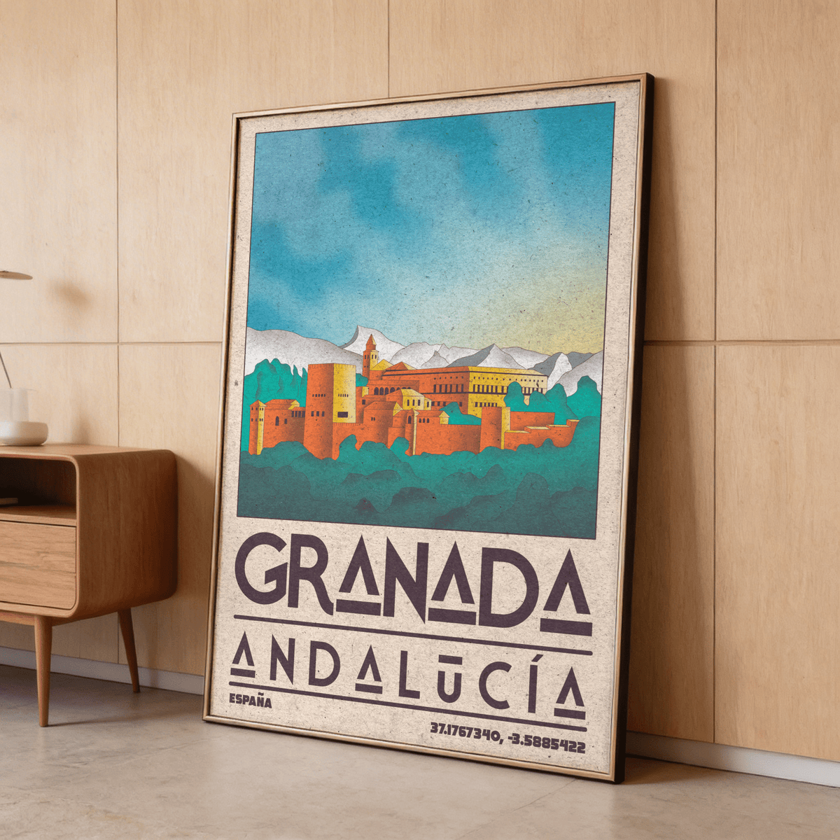 Framed Spanish City Poster of Alhambra fortress illustration with vintage colours leaning against wooden wall