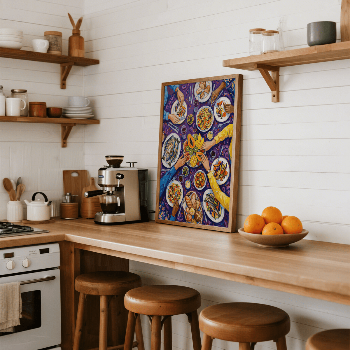 Colorful Dining Poster print leaning on kitchen counter with wooden stools and fruit bowl