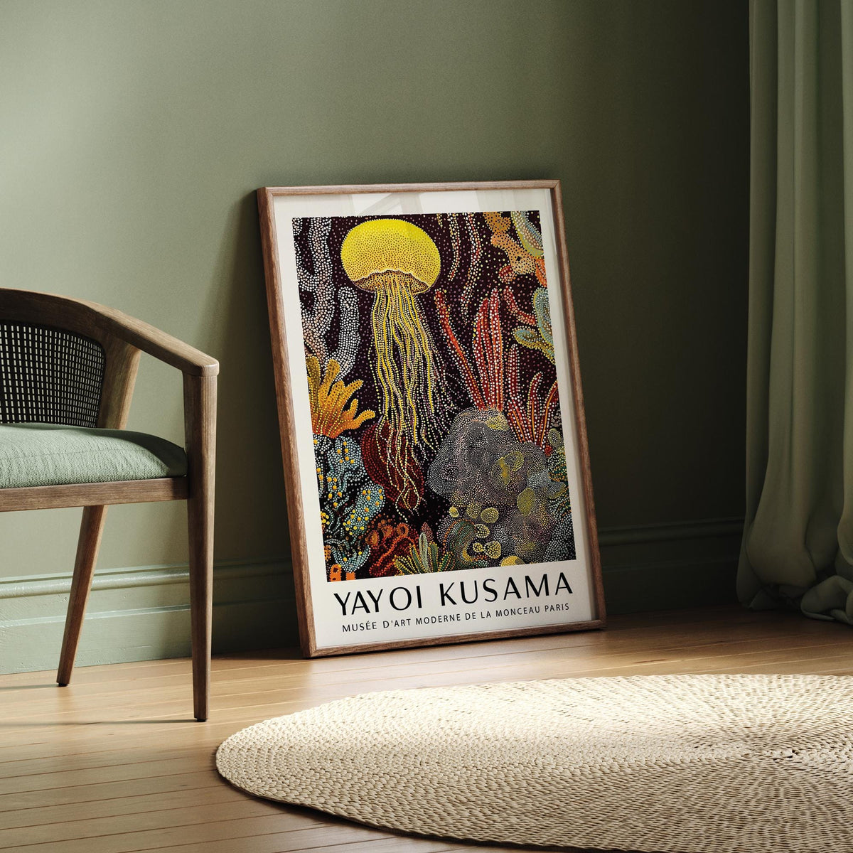Jellyfish poster print leaning on floor with green wall and chair nearby