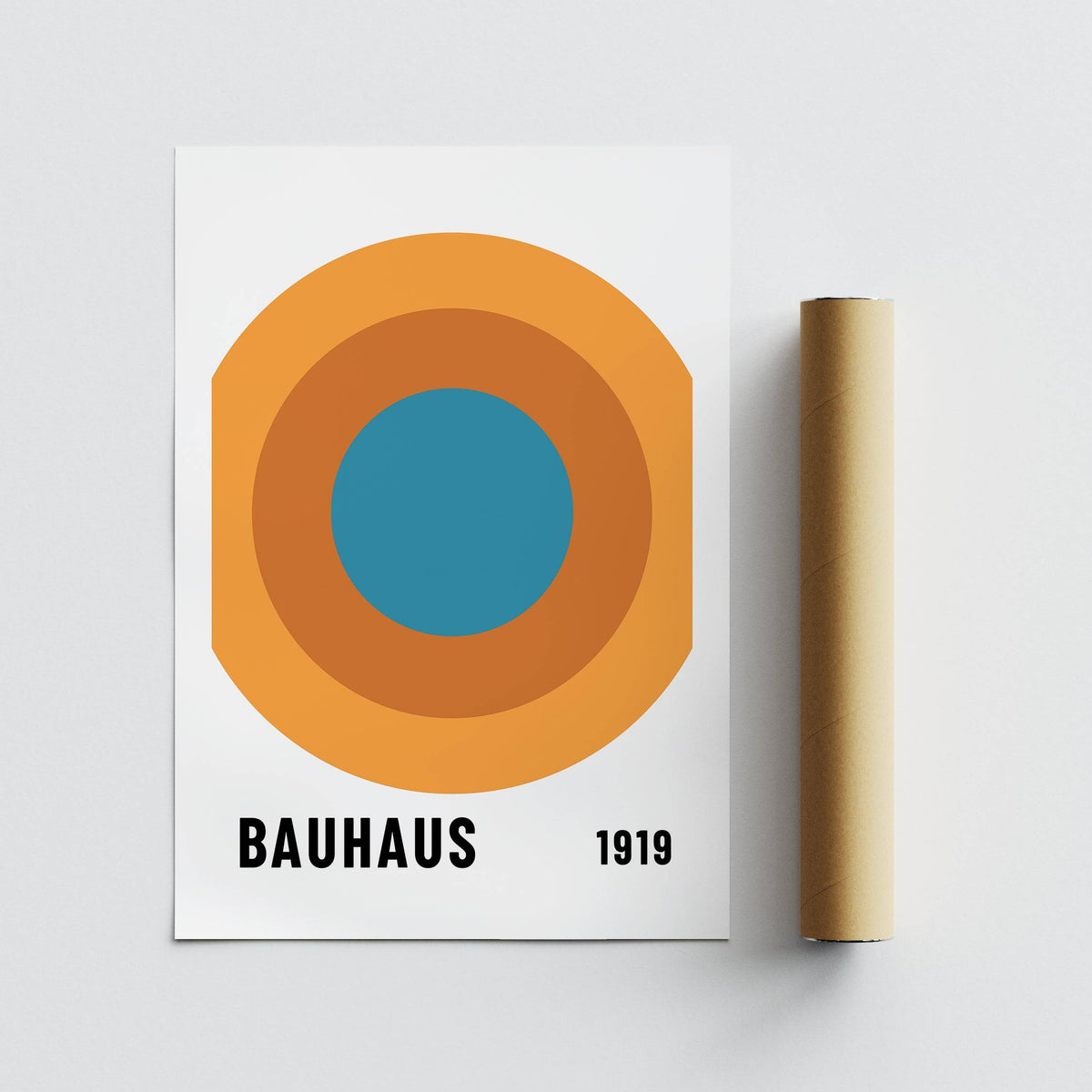 Bauhaus Circle Poster laid flat with a brown packaging tube on a white surface