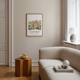 Print on a wall in a beige living room Florence Italy art print with a watercolour cityscape near a wooden side table with fruit
