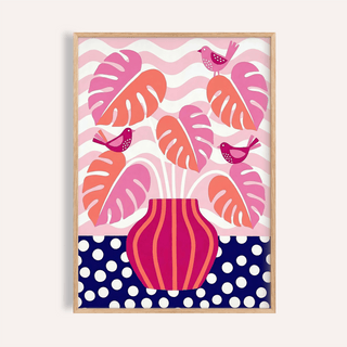 Framed tropical plant wall art with pink and orange monstera leaves and birds