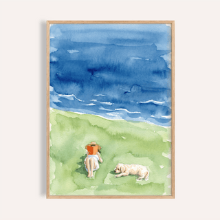 Framed print of a person reading with a dog beside them in watercolour style with blue and green hues