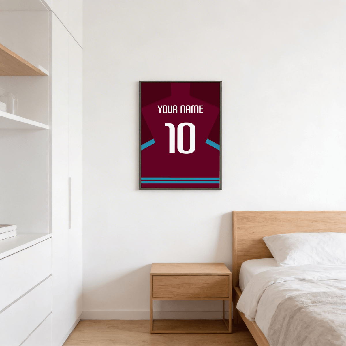 Football Shirt Poster in Claret with Light Blue Sleeve Trim hanging above a wooden bedside table in a bedroom