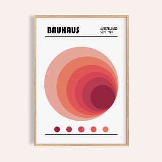 Framed print of Spiral Circle wall art in bauhaus style with concentric circles in reds