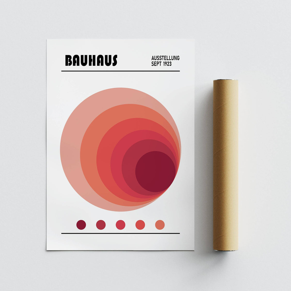 Wall Art Office print featuring concentric circles in red shades with a packaging tube beside it