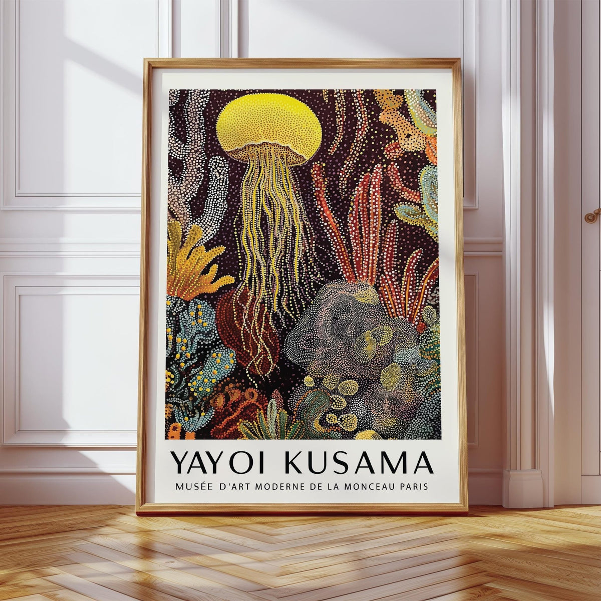 Framed Jellyfish Poster with yellow jellyfish and abstract polka-dot style leaning on a wooden floor