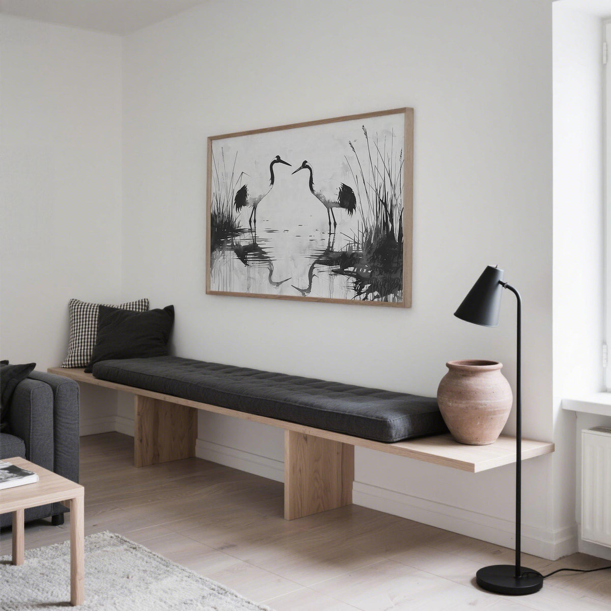 Minimalist Bird Art framed print with black white cranes in a calm room with a black floor lamp